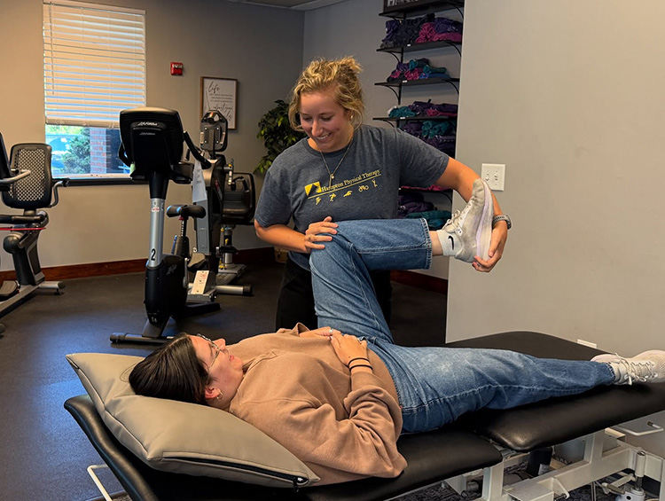 Jackie Zizza PTA assisting a patient at Hampton Physical Therapy